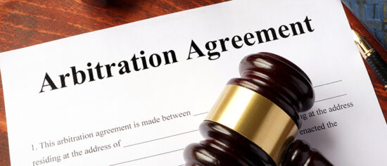Arbitration agreement form on an office table.