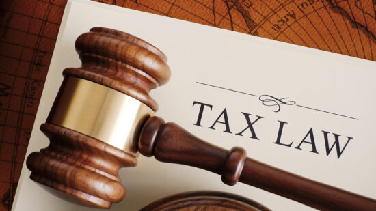Brown gavel on a white tax law document